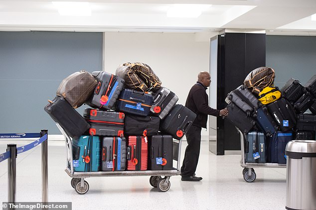 Madonna was seen with 26 bags on two trolleys for seven people when she jetted to London from New York