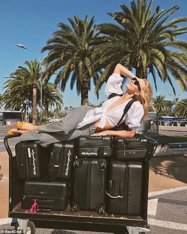 Model Karlie Kloss clearly doesn't struggle to pay the excess baggage fees with her seven suitcases