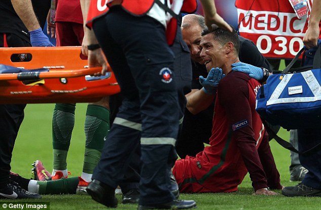 Portugal's captain tried to continue but was left in tears as he was taken off the field on a stretcher