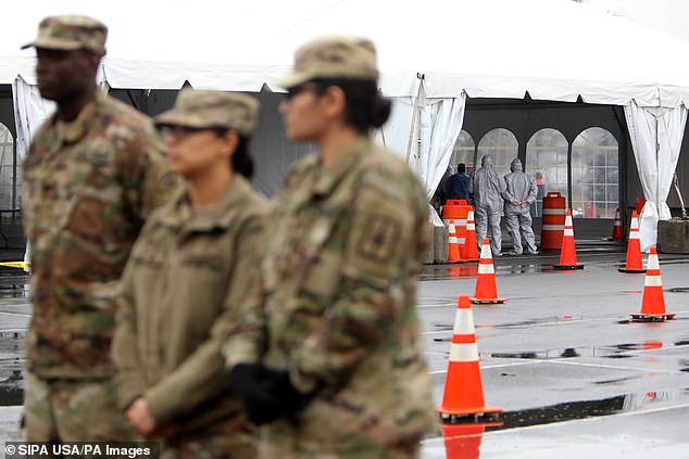 The National Guard and first responders are pictured at the drive-thru coronavirus testing facility on Glen Island Park in New Rochelle