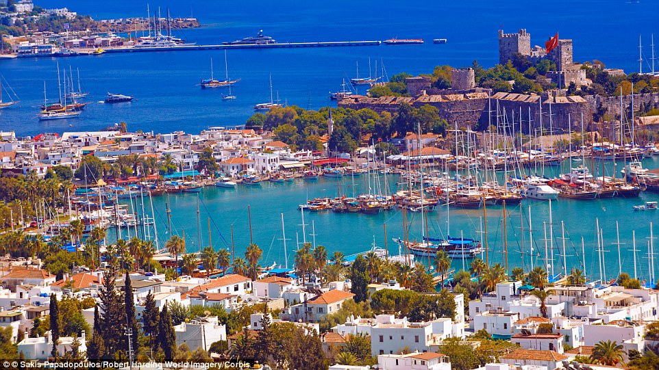 Glorious: The white-washed houses on Bodrum's harbour are charming. The town is dominated by its Castle of St Peter