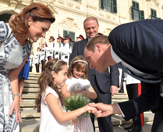 Prince William with the Maltese PM's daughters - The Duke of Cambridge earlier apologised for Kate's absence