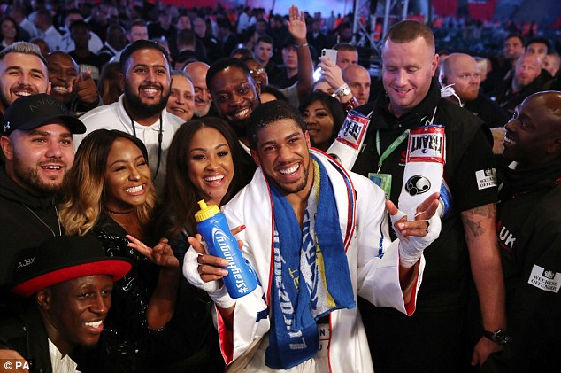 AJ poses with spectators, including Manchester City's Benjamin Mendy, after the Povetkin win