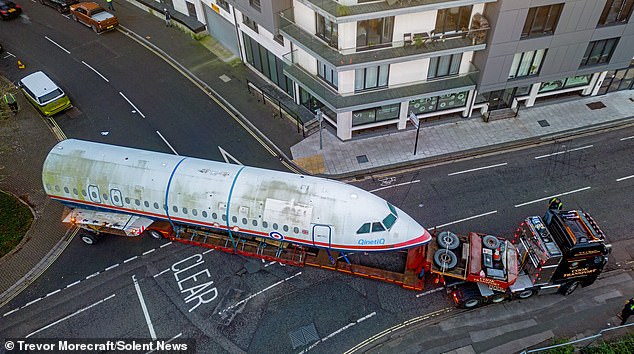 Plane crazy sight! Traffic stopped in Southampton as a jetliner is hauled through the city on the back of a truck